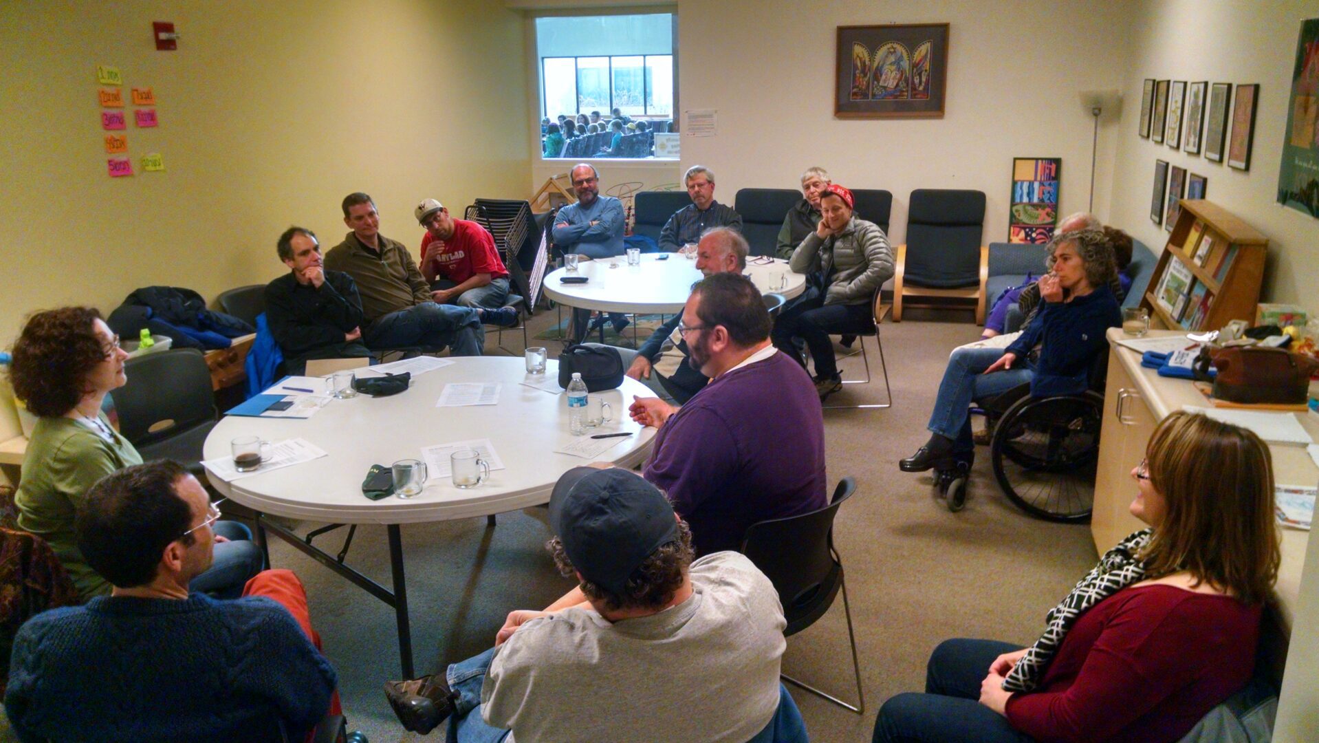 A group of people sitting around a table.