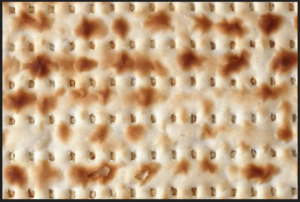 A close up of the top part of a matzah.