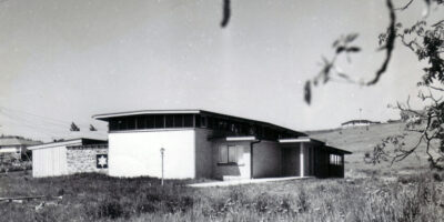 A black and white photo of an old house