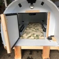 A small room with a bed inside of it